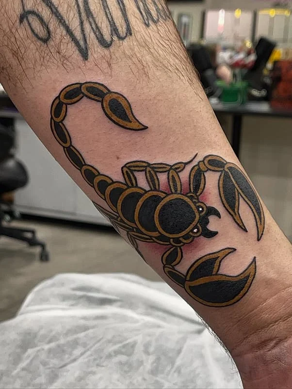 Traditional scorpion tattoo on a forearm.