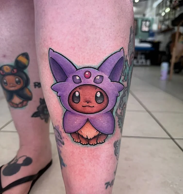 Colorful illustrative tattoo of a cute fantasy character on calf.