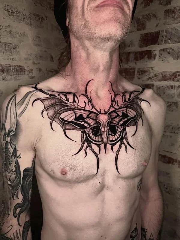 Large blackwork moth and skull chest piece