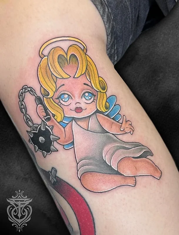 Colorful new-school angel tattoo on arm.
