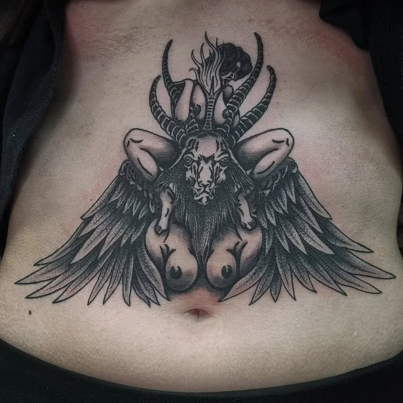 Large black-and-grey chest tattoo of a mythical creature.