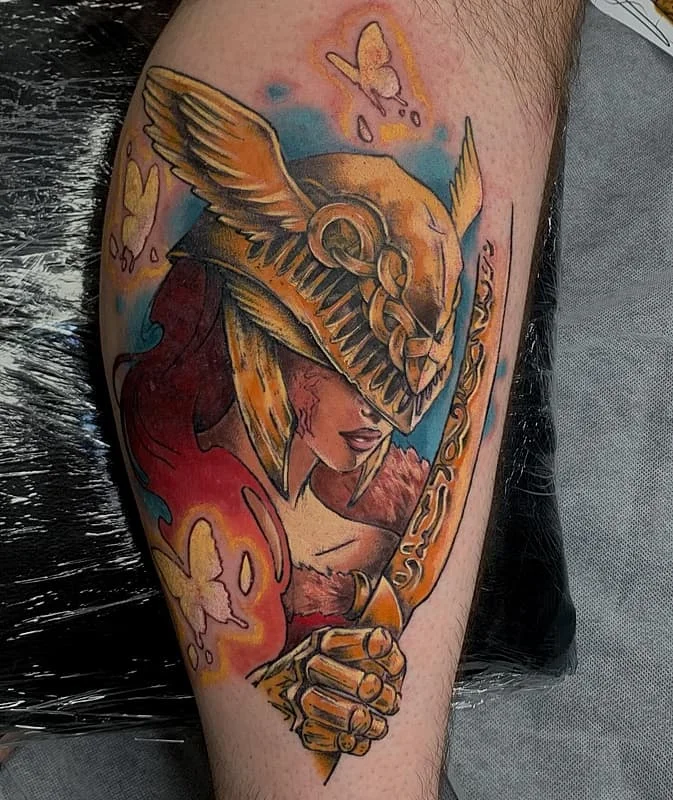 Colorful warrior tattoo with butterflies on forearm.
