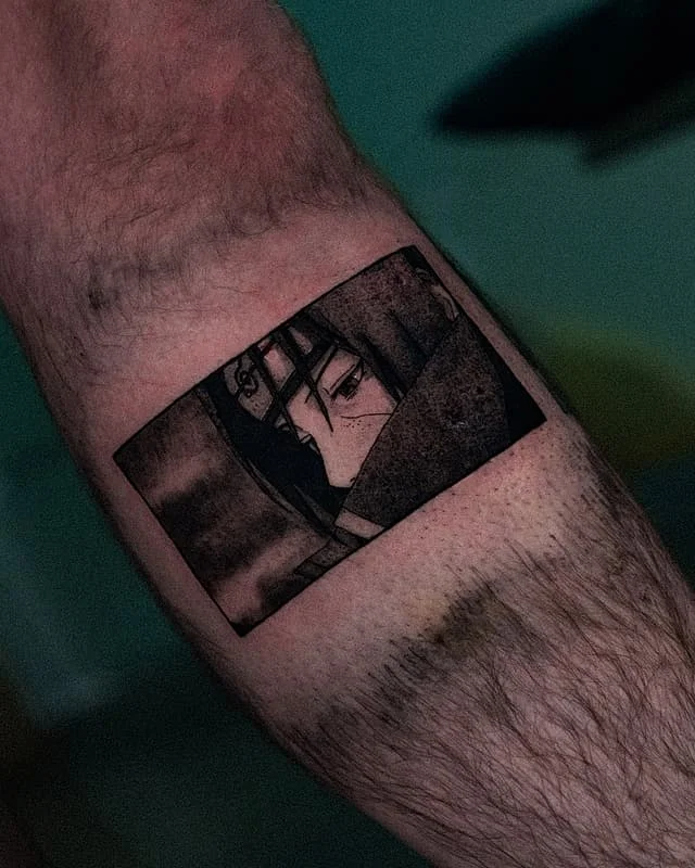 Medium blackwork anime character tattoo on forearm.