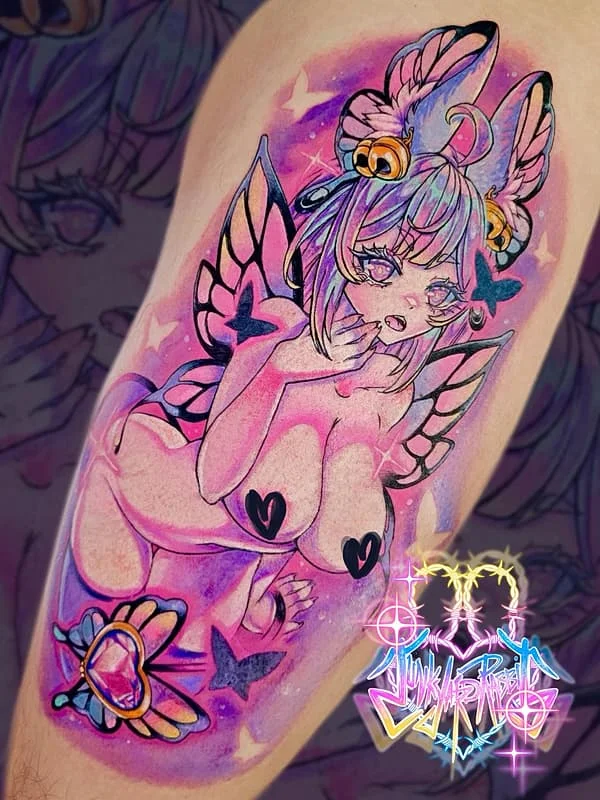 Colorful watercolor fairy tattoo on arm.