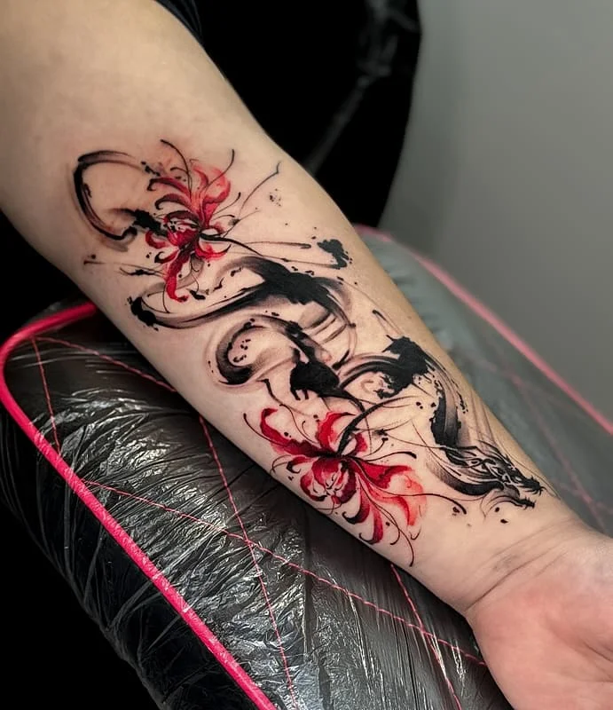 Dynamic floral watercolor tattoo on forearm.