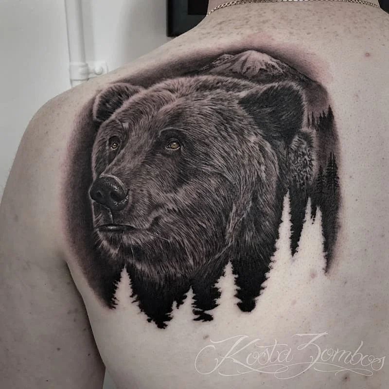 Realistic bear tattoo on the back.