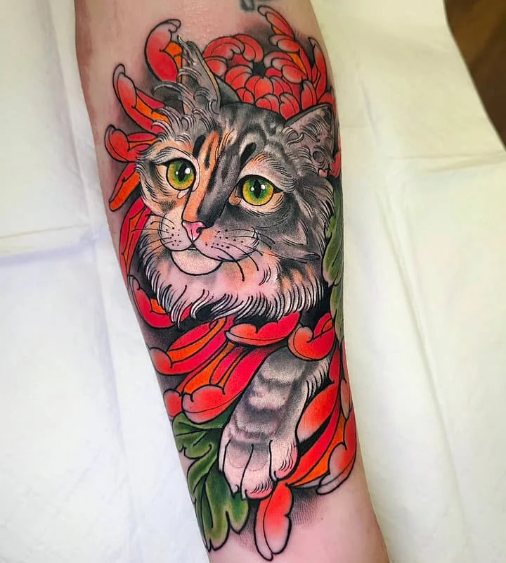 Illustrative cat tattoo with colorful flowers on forearm.