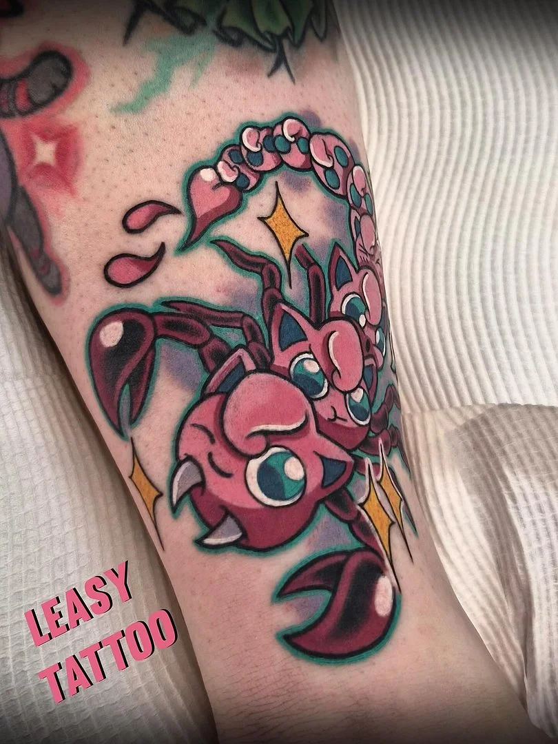 Colorful new-school scorpion tattoo on forearm.