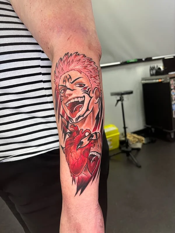 Vibrant anime character tattoo on forearm.