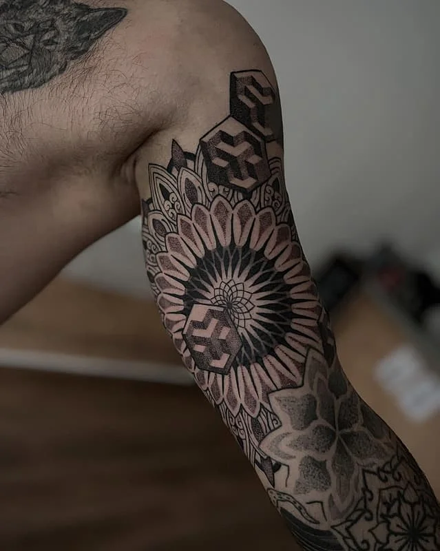 Blackwork geometric full sleeve on arm and forearm