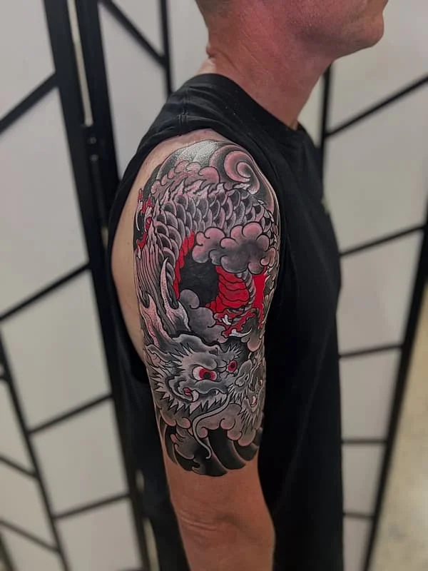Japanese dragon tattoo on a man's arm.
