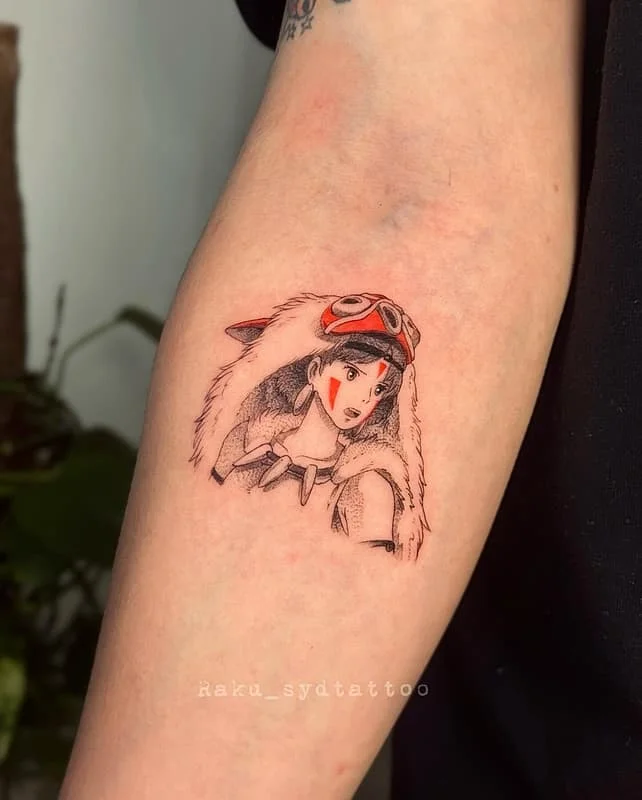 Illustrative anime character tattoo on forearm.