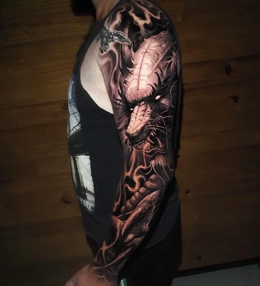 Black and grey realism full sleeve with lion and flames