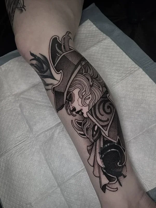 Bold blackwork ornamental tattoo on forearm