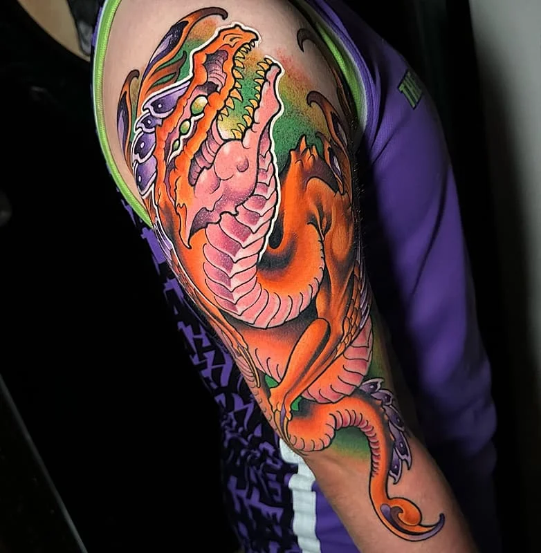 Vibrant dragon tattoo on a person's arm.