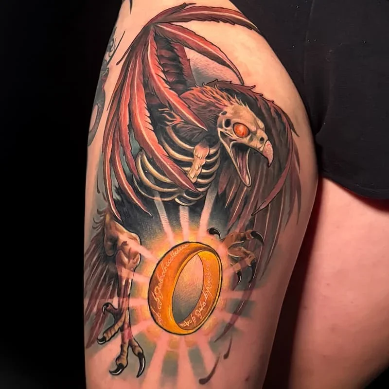 Large illustrative eagle skeleton tattoo on arm