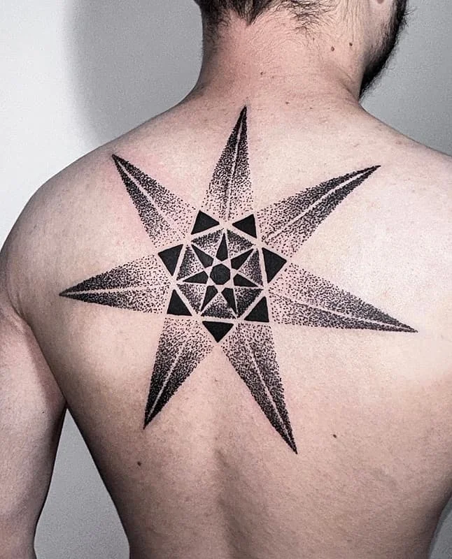 Large geometric star tattoo on a man's back.