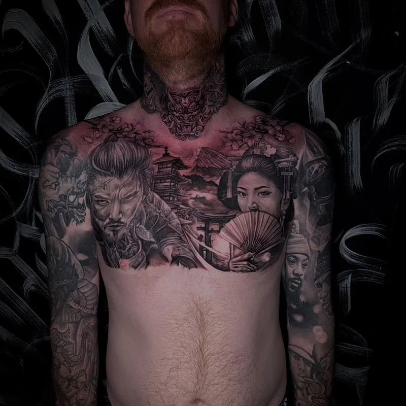 Large black-and-grey Japanese tattoo on chest and arms.