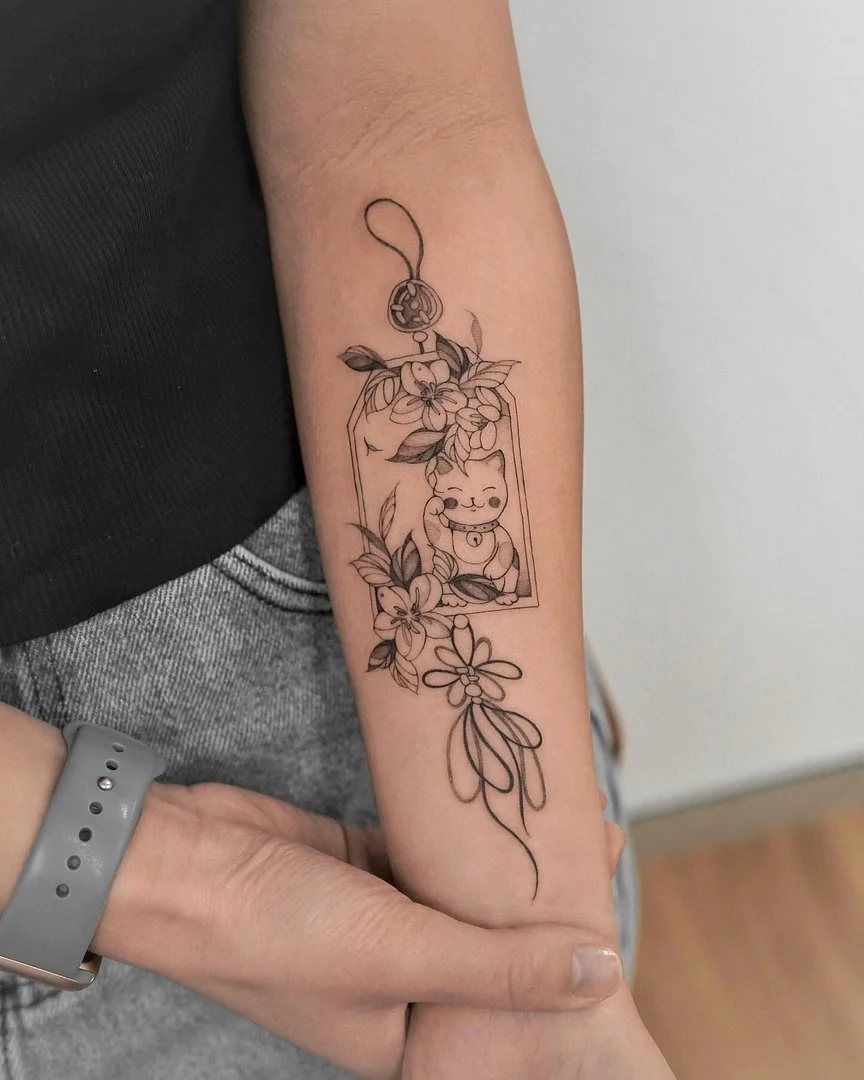 Fine-line tattoo of a cute animal with flowers on forearm.