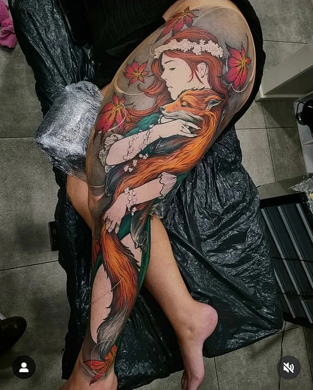 Large colorful leg tattoo of a girl and a fox.